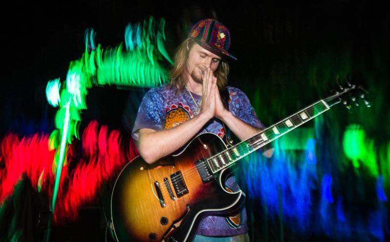 Cualli playing Guitar